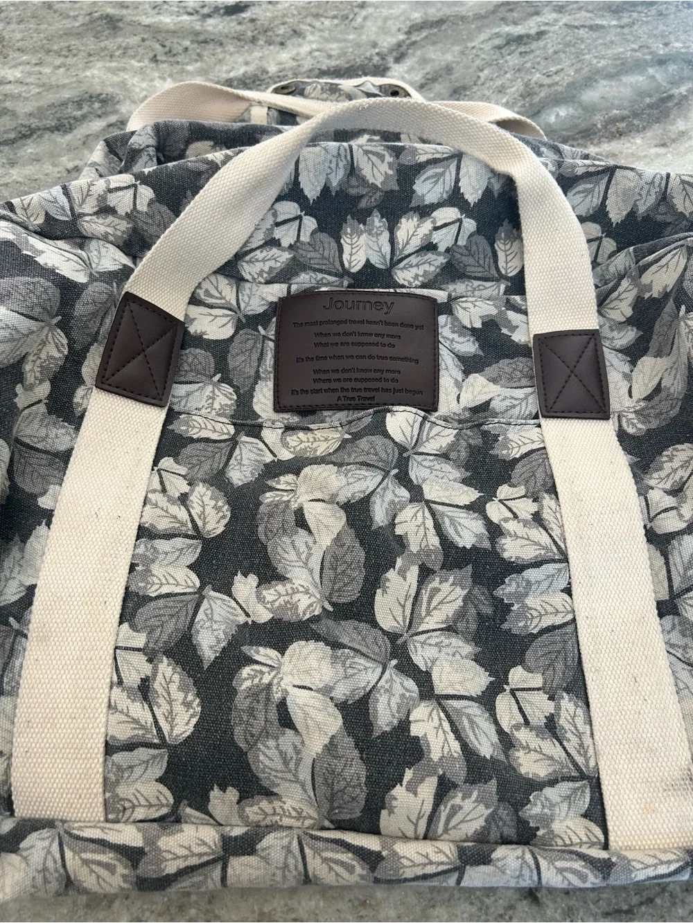 Journey Canvas Leaf-Print Tote Bag in Gray measures approximately 12x20 inches